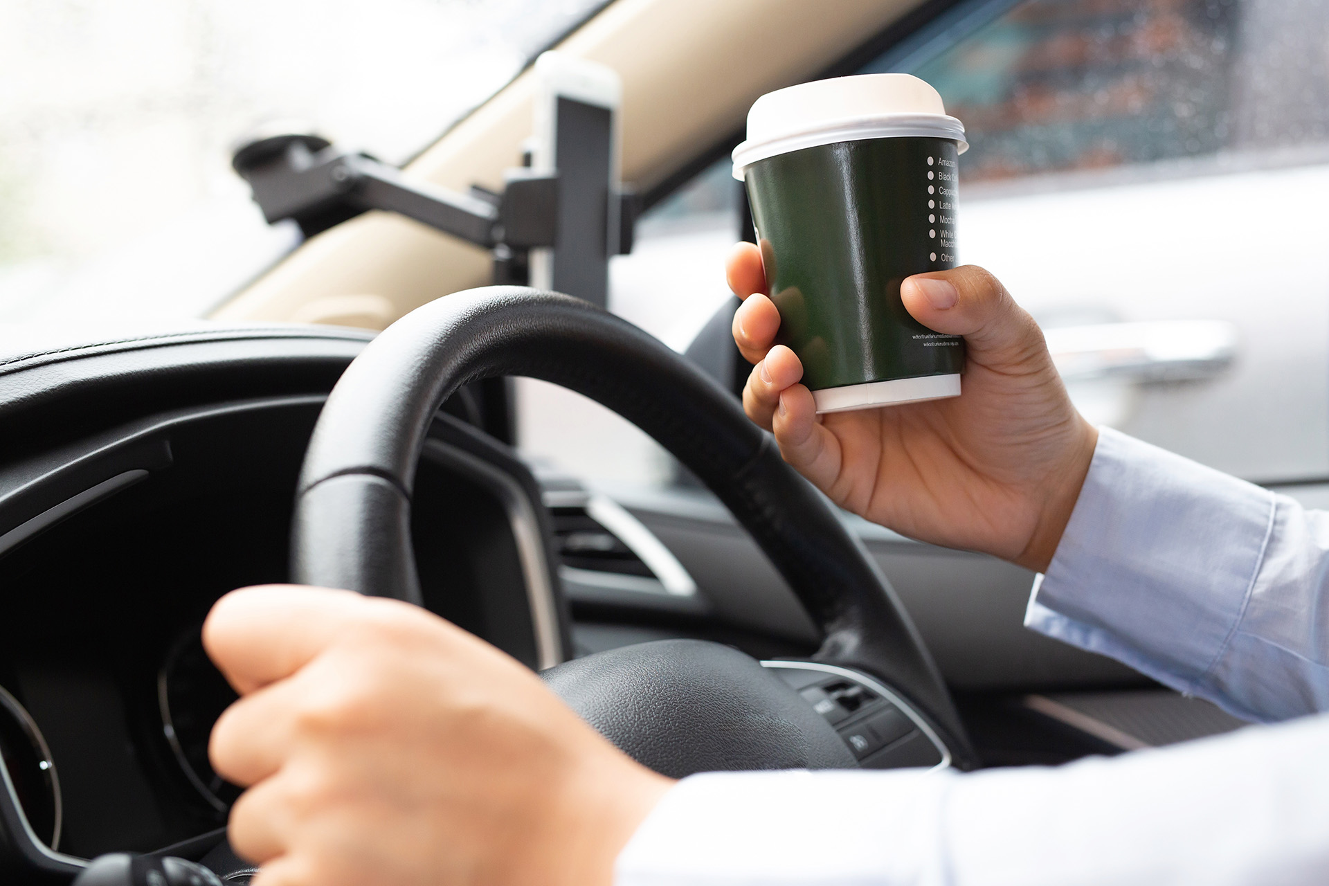 Distracted Driving Accidents Caused by Coffee AdobeStock 396045267